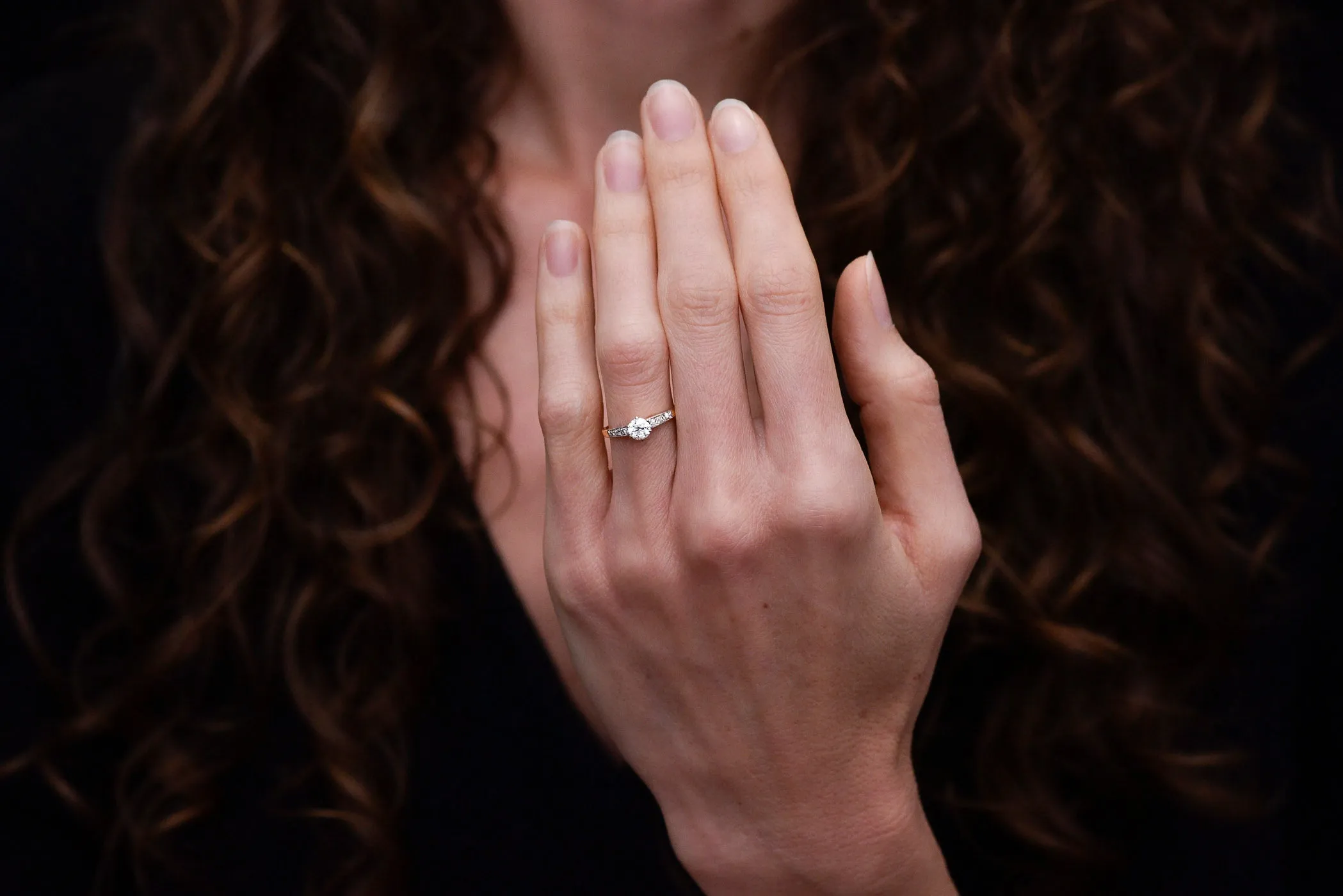 c. 1900s Gold and Platinum Ring with an Old European Cut Diamond Center and Antique Rose Cut Accents