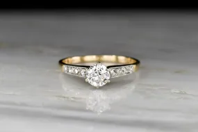 c. 1900s Gold and Platinum Ring with an Old European Cut Diamond Center and Antique Rose Cut Accents